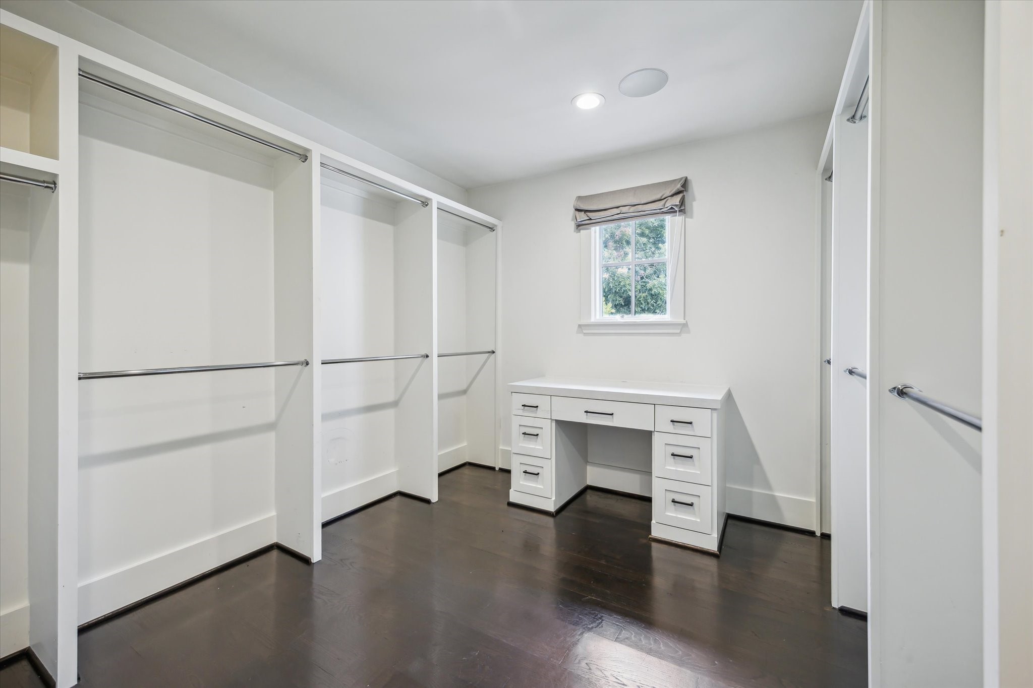 3214 Westheimer Road Houston, TX 77098 - Photo 20 of 34 a view of an empty room with a window and wooden floor
