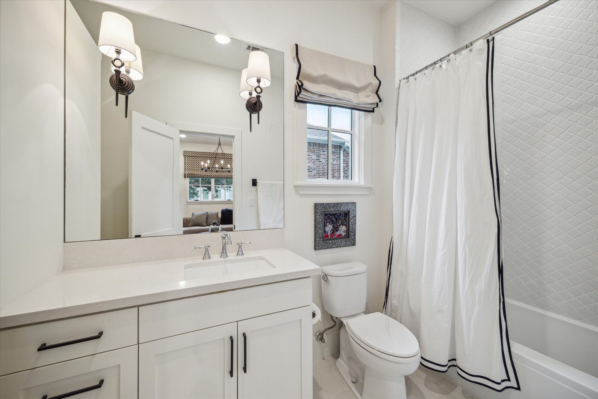 3214 Westheimer Road Houston, TX 77098 - Photo 25 of 34 a bathroom with a sink a toilet a mirror and shower