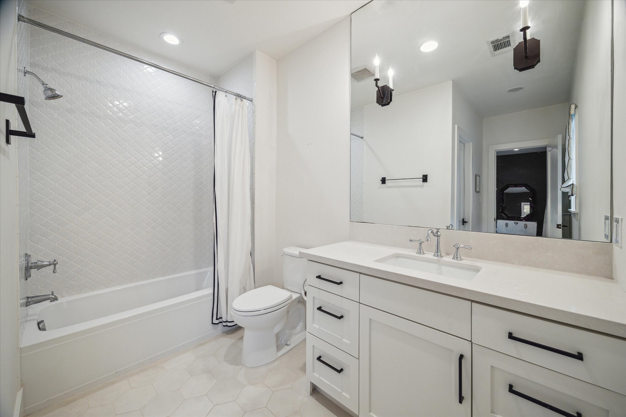3214 Westheimer Road Houston, TX 77098 - Photo 29 of 34 a bathroom with a granite countertop sink a toilet and shower
