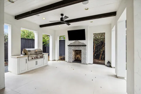 a view of living room with furniture and a fireplace