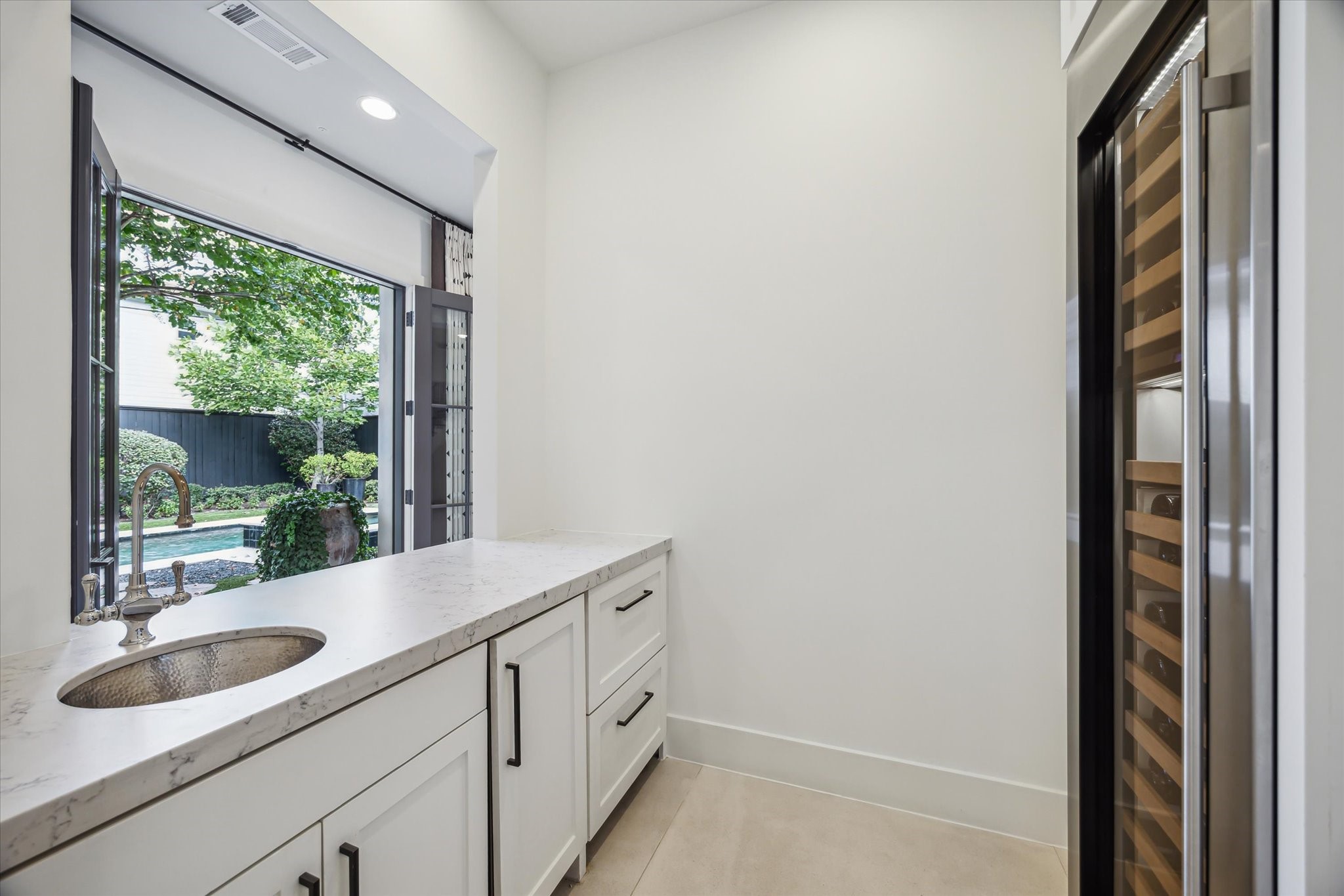 3214 Westheimer Road Houston, TX 77098 - Photo 7 of 34 a view of a sink and a mirror