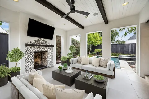 a living room with furniture fireplace and flat screen tv