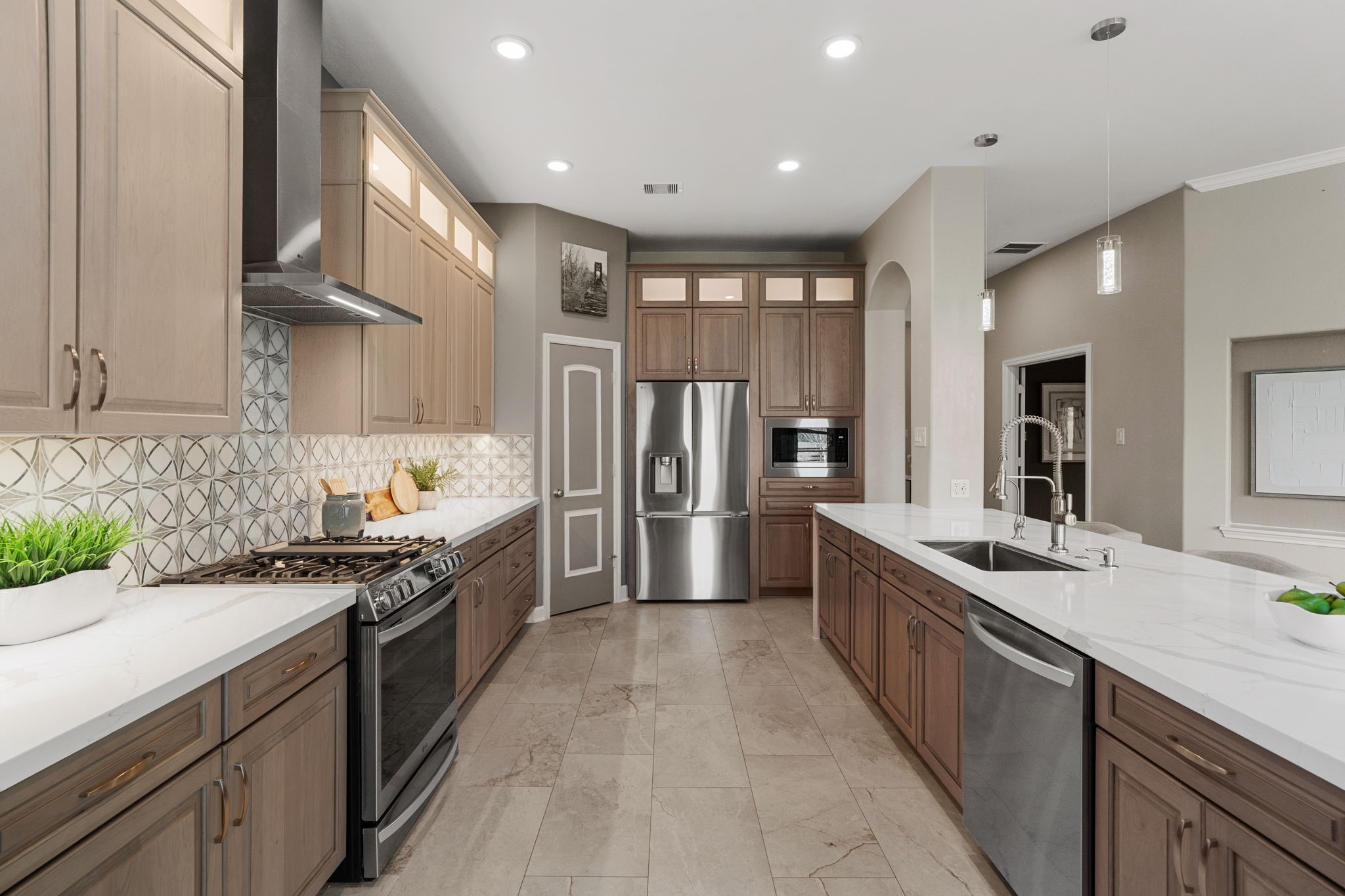 3426 Summer Ranch Drive Katy, TX 77494 - Photo 15 of 48 Expansive counter space and a functional layout make meal prep effortless, while quality finishes and ample storage keep everything organized and within reach.