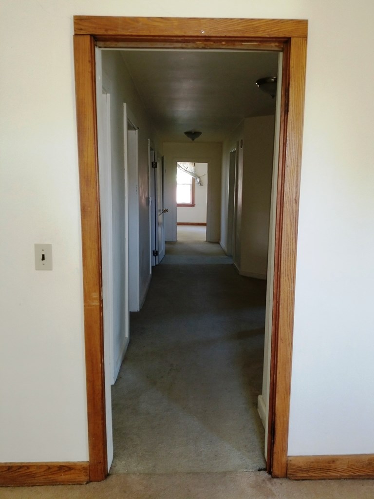 410 Main Street Strattanville, PA 16258 - Photo 5 of 7 a view of a hallway with wooden floor