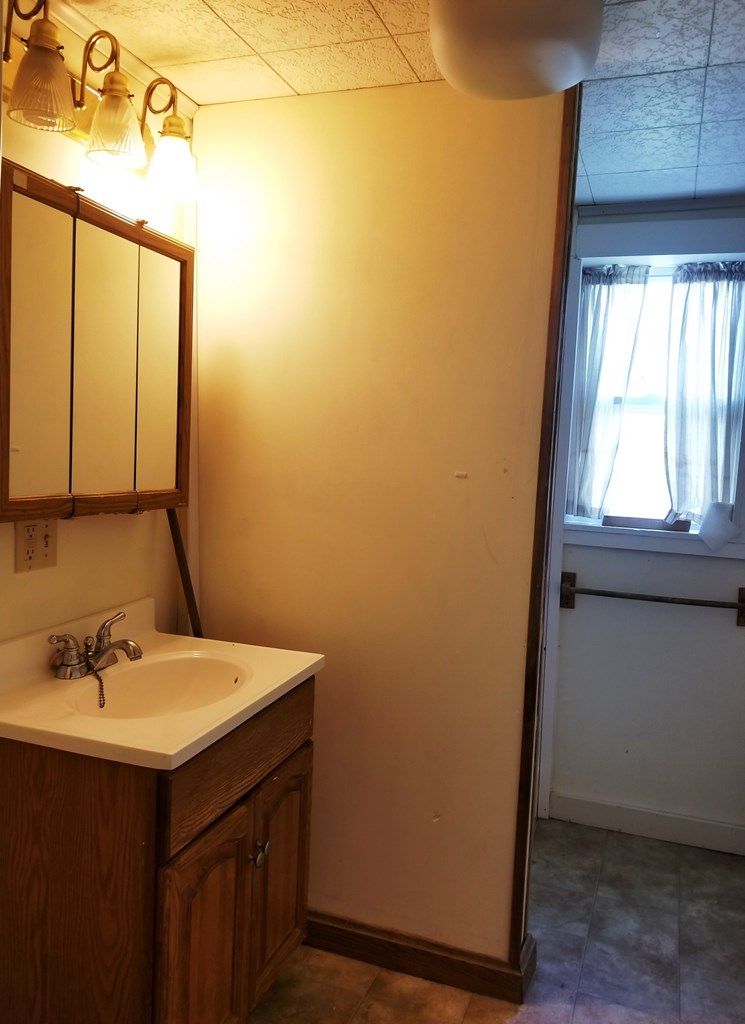 410 Main Street Strattanville, PA 16258 - Photo 7 of 7 a bathroom with a sink and a mirror