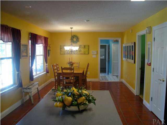 5678 Riviera Drive Milton, FL 32583 - Photo 8 of 24 View from Kitchen into Dining area