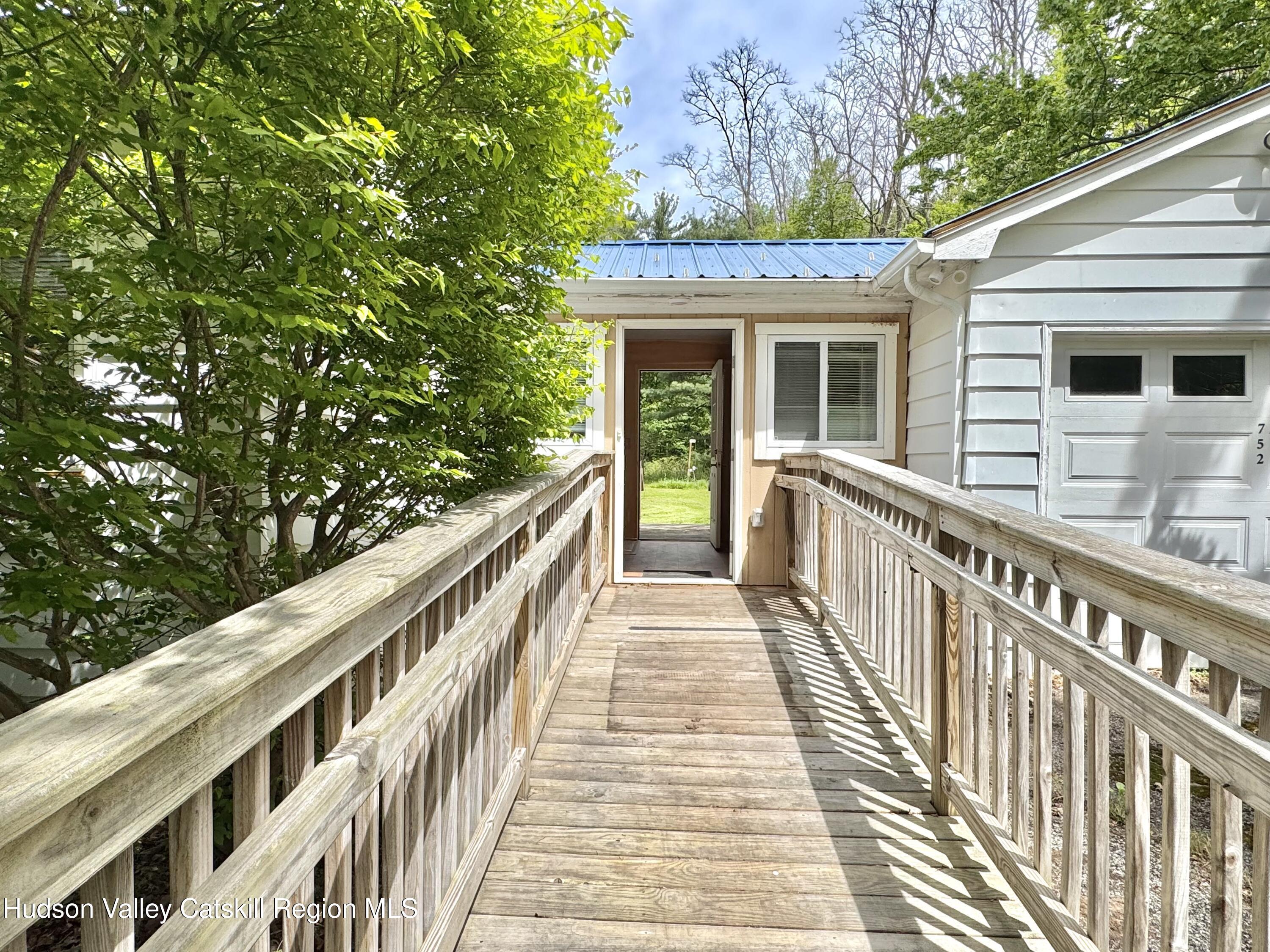 752 Old Rte 23 Acra, NY 12405 - Photo 2 of 25 a view of a balcony with wooden floor and fence