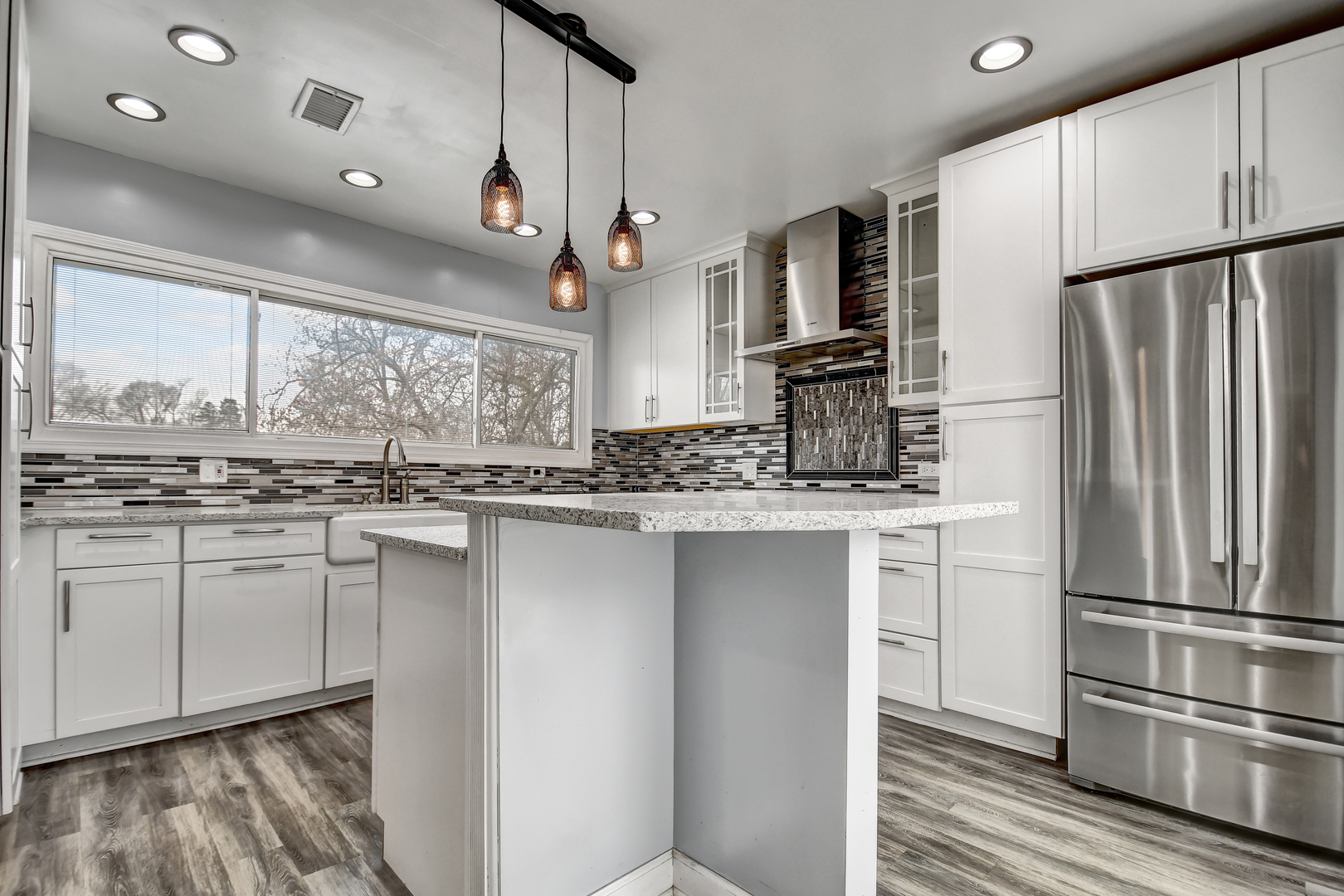 2425 Flossmoor Road Flossmoor, IL 60422 - Photo 8 of 21 a kitchen with stainless steel appliances granite countertop a refrigerator a stove and a sink