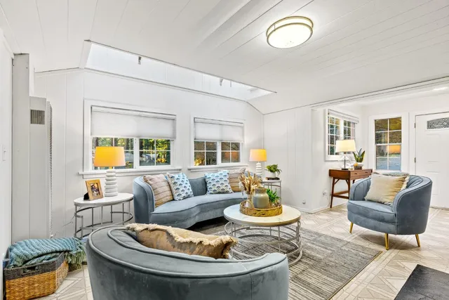 a living room with furniture and a table