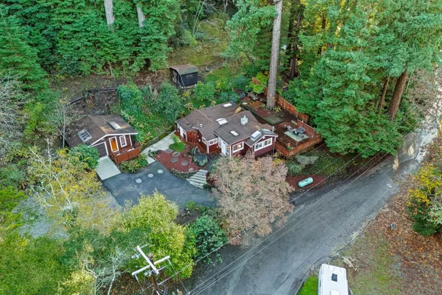 an aerial view of a house with a yard