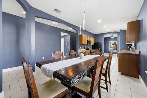 a kitchen with a sink cabinets and appliances
