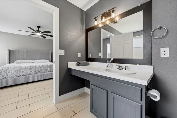 a white bath tub sitting next to a shower