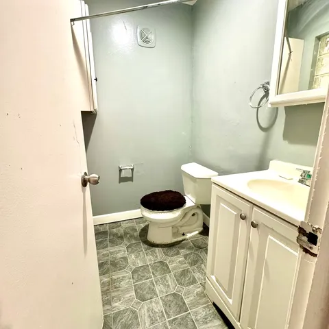 a bathroom with a sink and a toilet