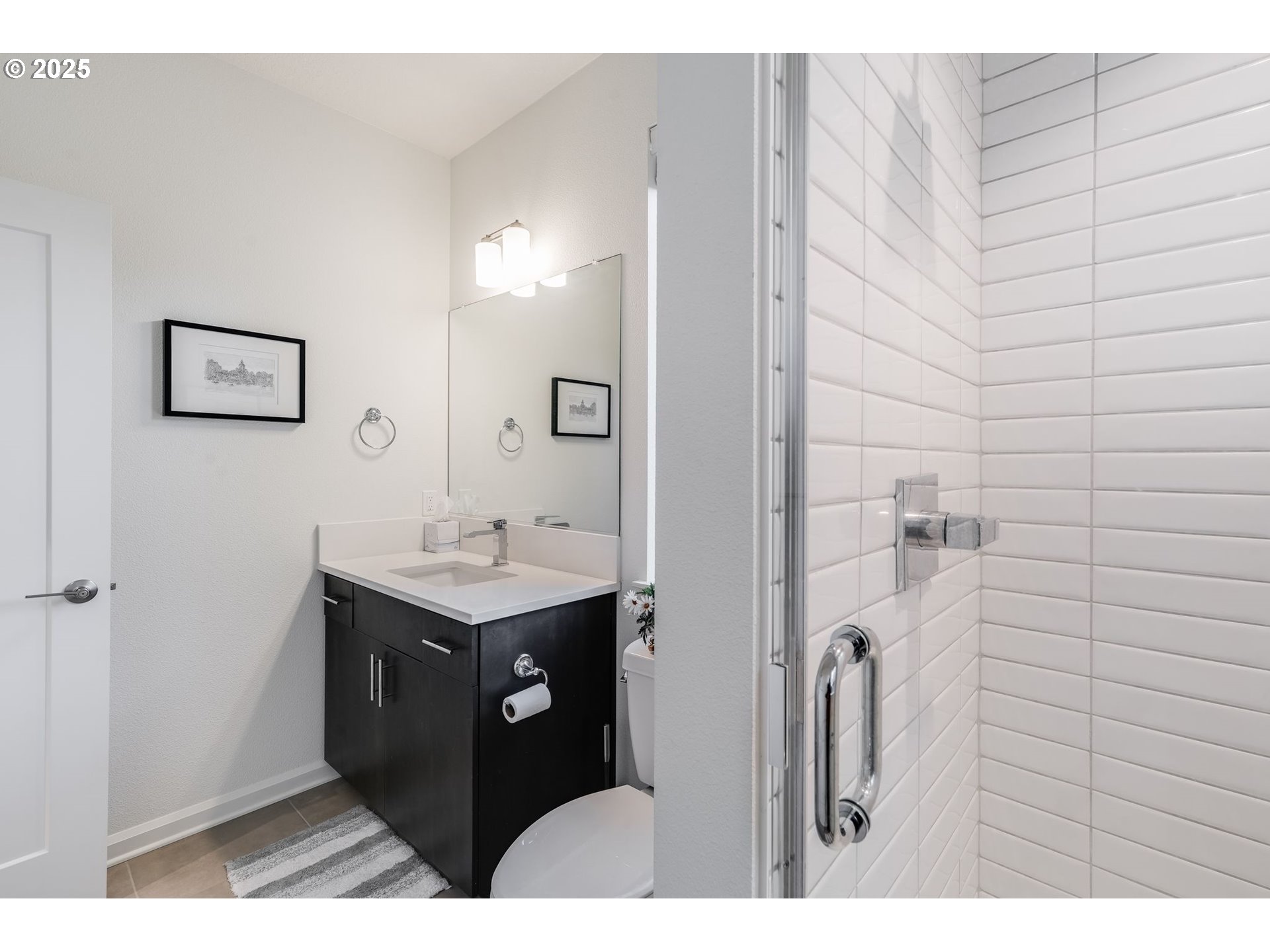 77 Northeast 58th Avenue Portland, OR 97213 - Photo 14 of 36 a bathroom with a sink and a mirror