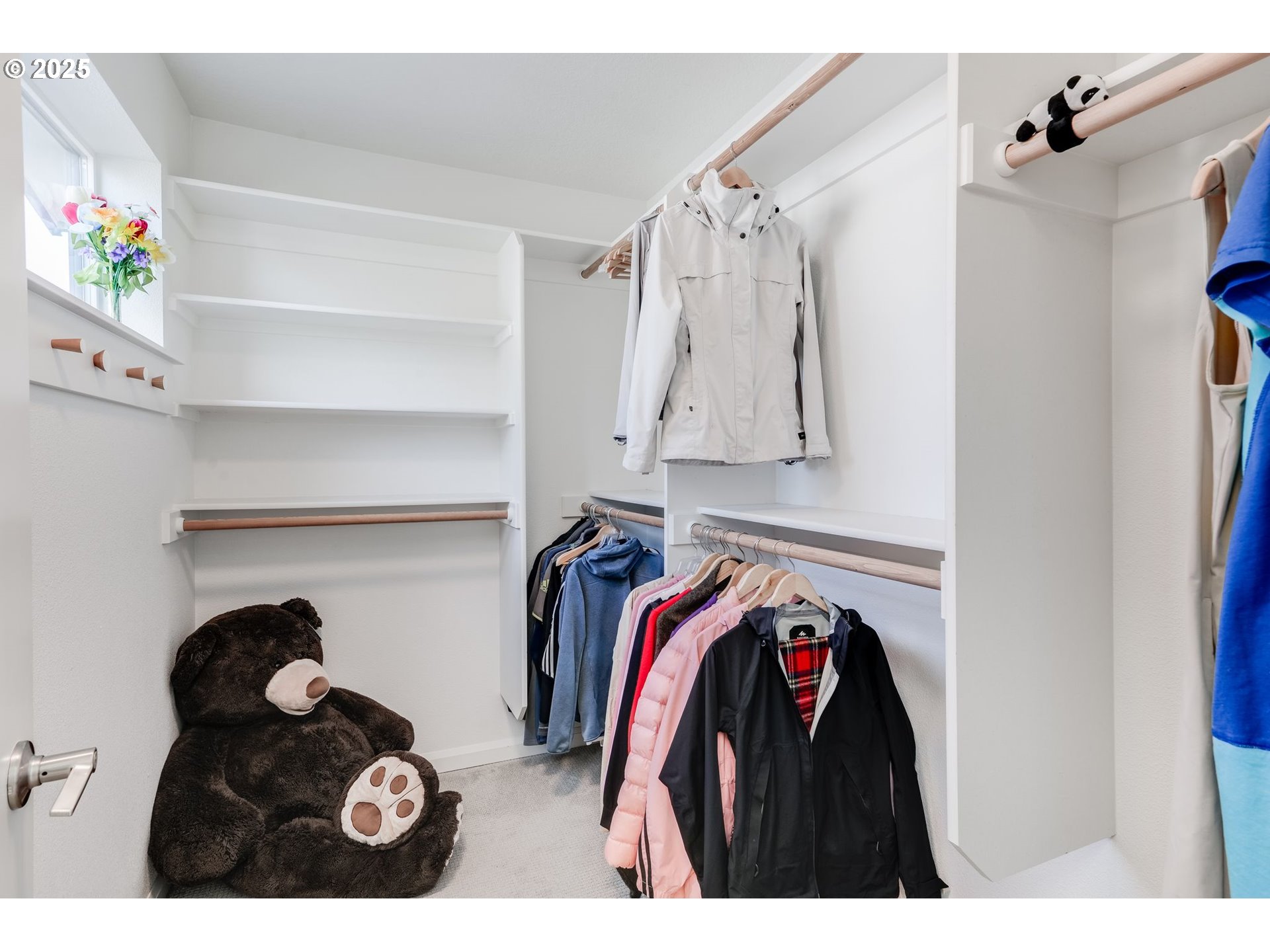 77 Northeast 58th Avenue Portland, OR 97213 - Photo 19 of 36 a view of walk in closet with clothes and shoes