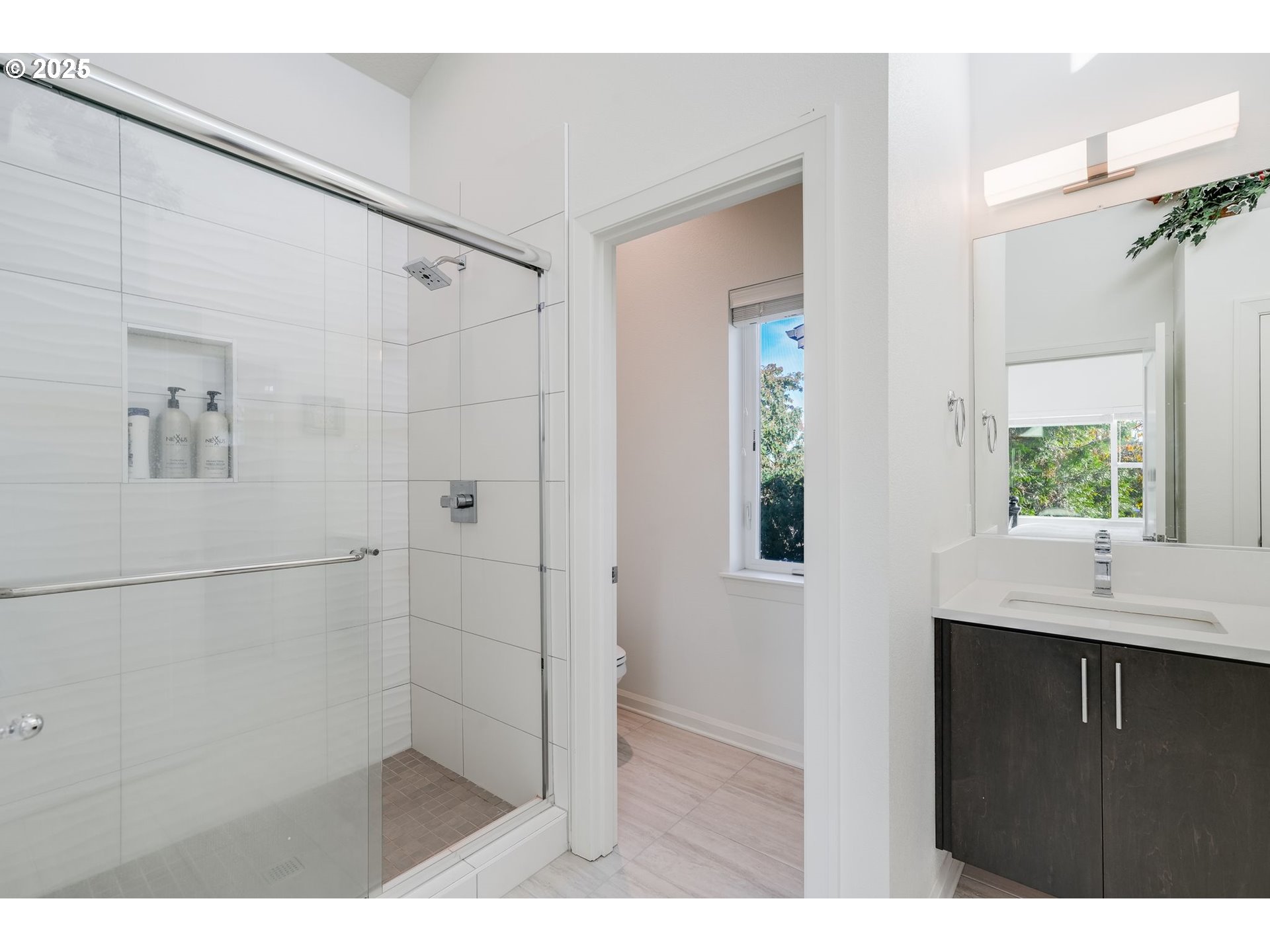 77 Northeast 58th Avenue Portland, OR 97213 - Photo 21 of 36 a bathroom with a sink and a mirror
