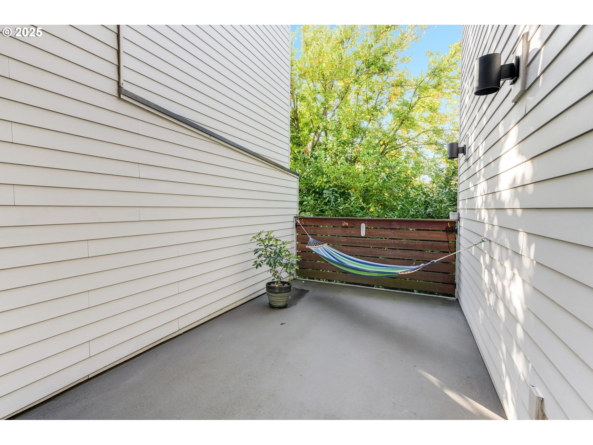 77 Northeast 58th Avenue Portland, OR 97213 - Photo 24 of 36 a backyard of a house with outdoor seating