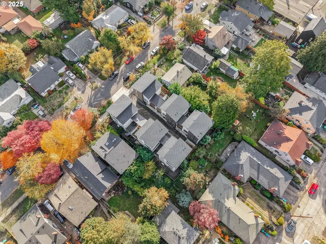 an aerial view of a house with table and chairs