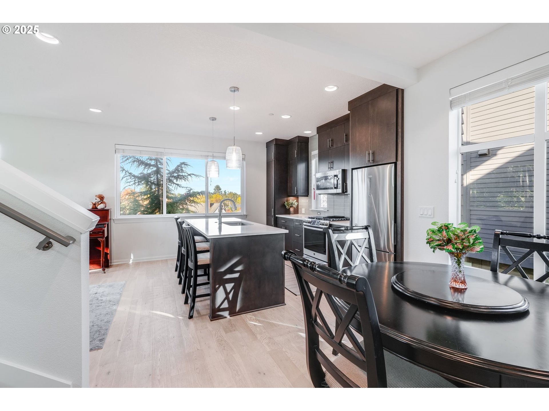 77 Northeast 58th Avenue Portland, OR 97213 - Photo 4 of 36 a dining room with furniture and a kitchen view