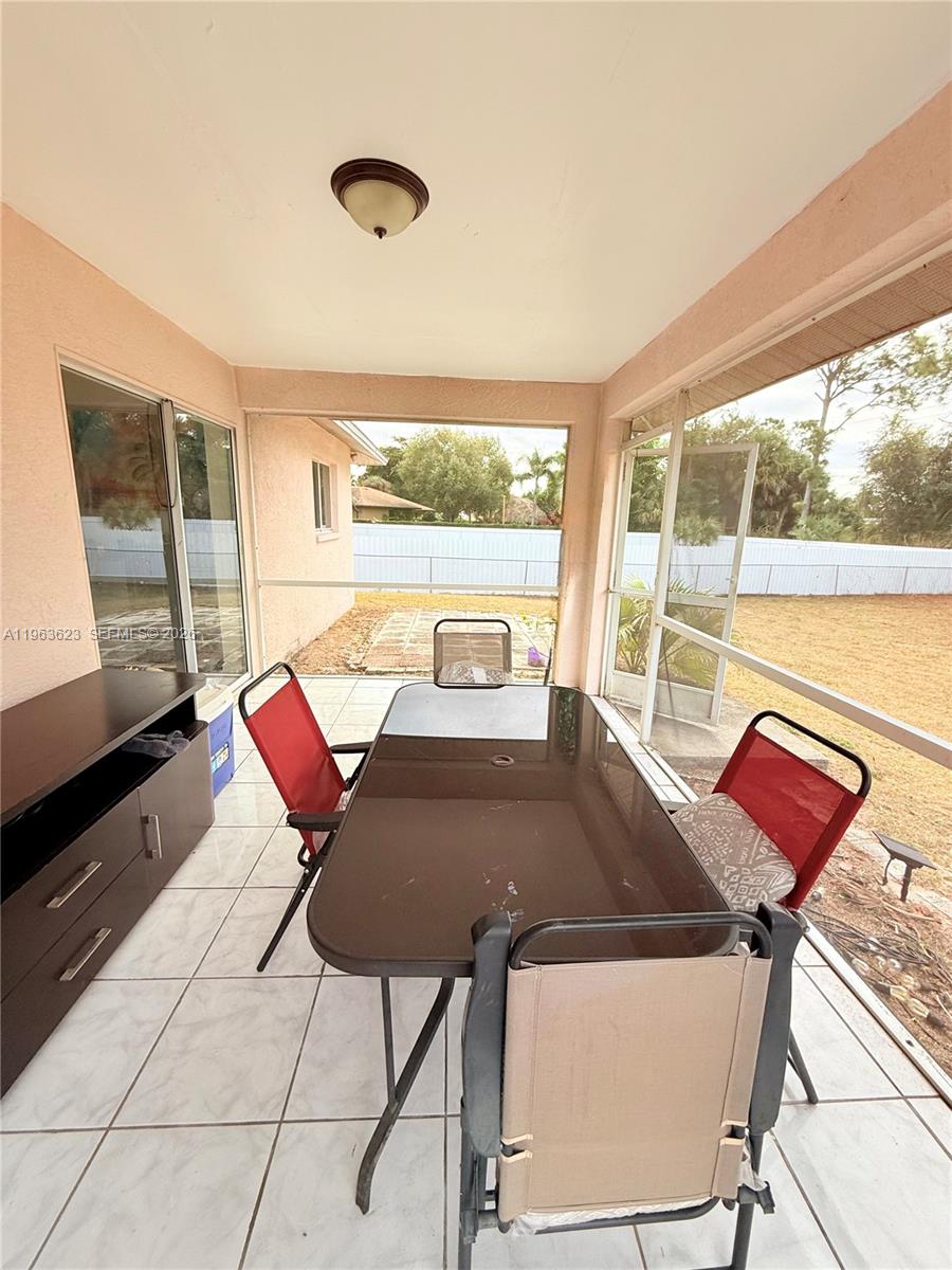 755 Arundel Circle Fort Myers, FL 33913 - Photo 20 of 22 a view of a dining room with furniture window and outside view