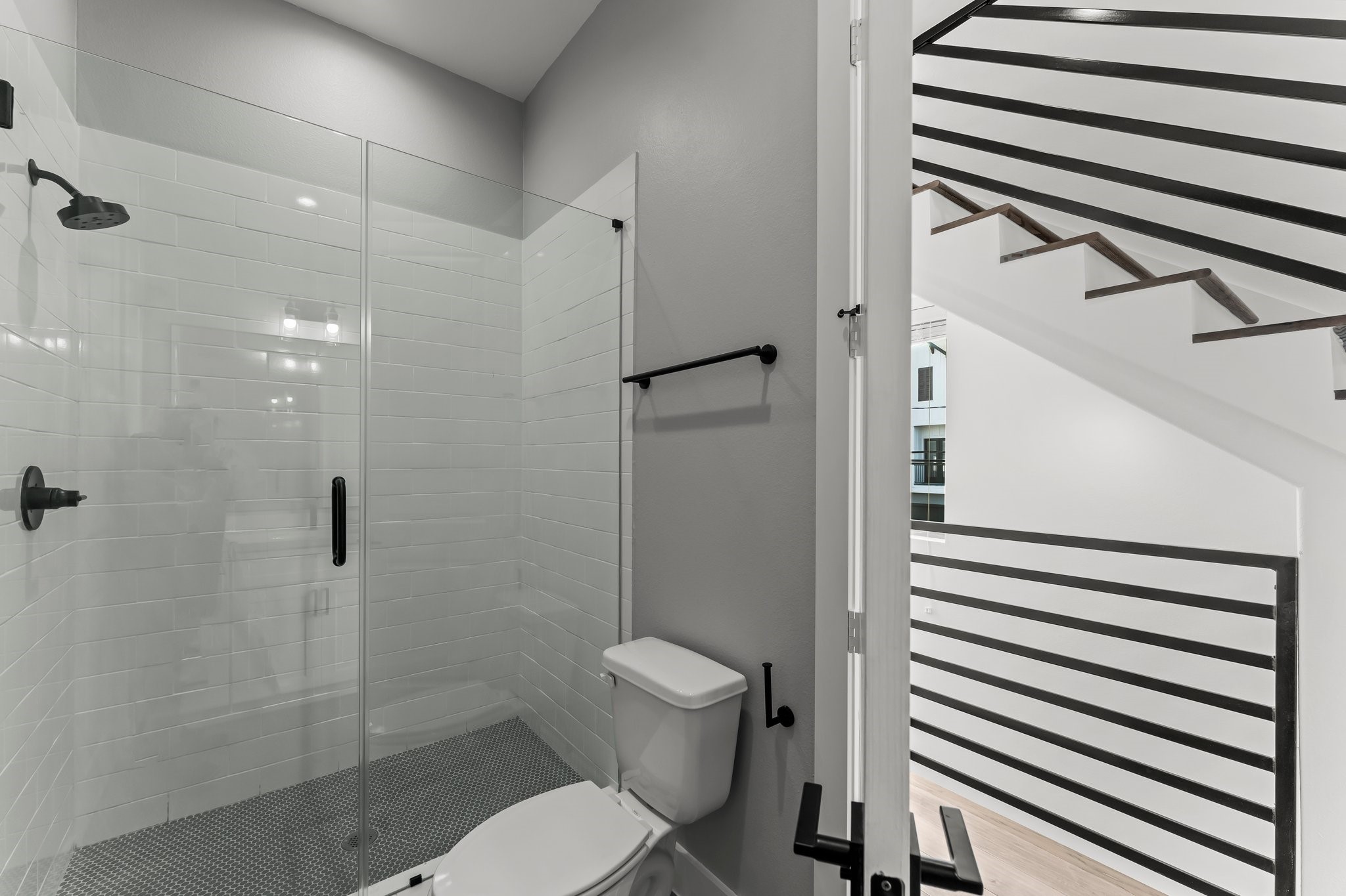 1602 Chestnut Street Houston, TX 77009 - Photo 24 of 49 a bathroom with a toilet and a shower