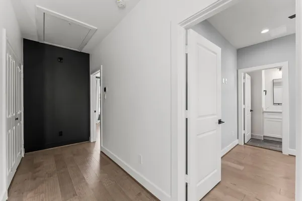 a bathroom with double sink and a mirror