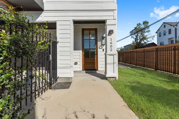 a view of a workspace with furniture and wooden floor