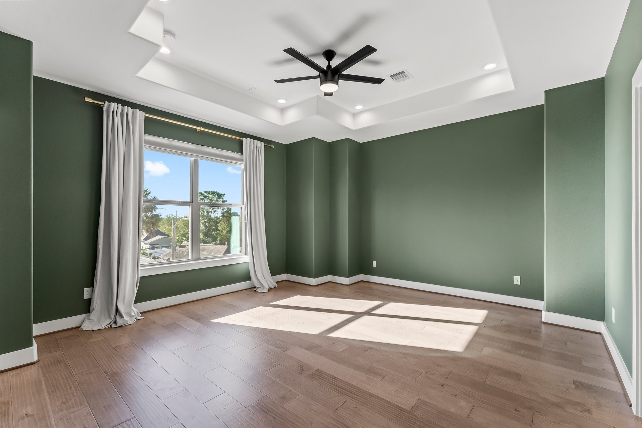 1602 Chestnut Street Houston, TX 77009 - Photo 31 of 49 a view of an empty room with a ceiling fan and window