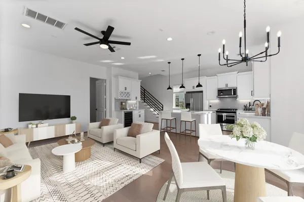 a kitchen with stainless steel appliances kitchen island a stove a sink and a refrigerator