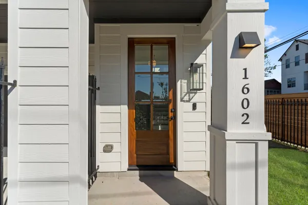 an empty room with a ceiling fan and a window