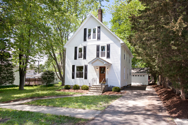 306 Read Street Elburn, IL 60119 - Photo 1 of 18 a front view of a house with a yard and garage