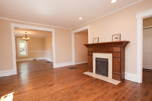 306 Read Street Elburn, IL 60119 - Photo 4 of 18 a view of an empty room with wooden floor and a fireplace