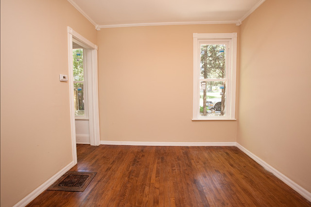 306 Read Street Elburn, IL 60119 - Photo 7 of 18 an empty room with wooden floor and windows