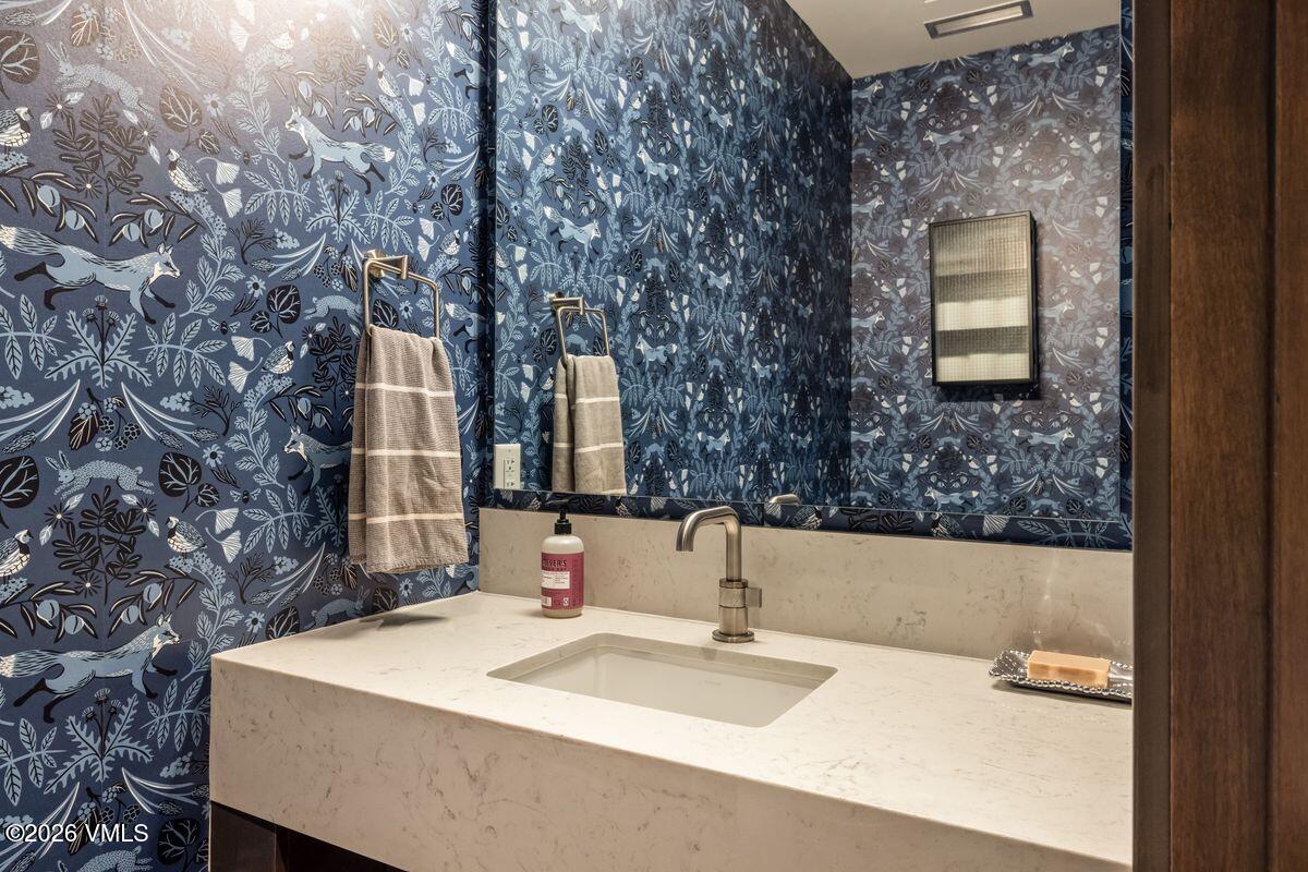 430 South Frontage Road East, Unit RU303 Vail, CO 81657 - Photo 13 of 39 a bathroom with a sink and a mirror