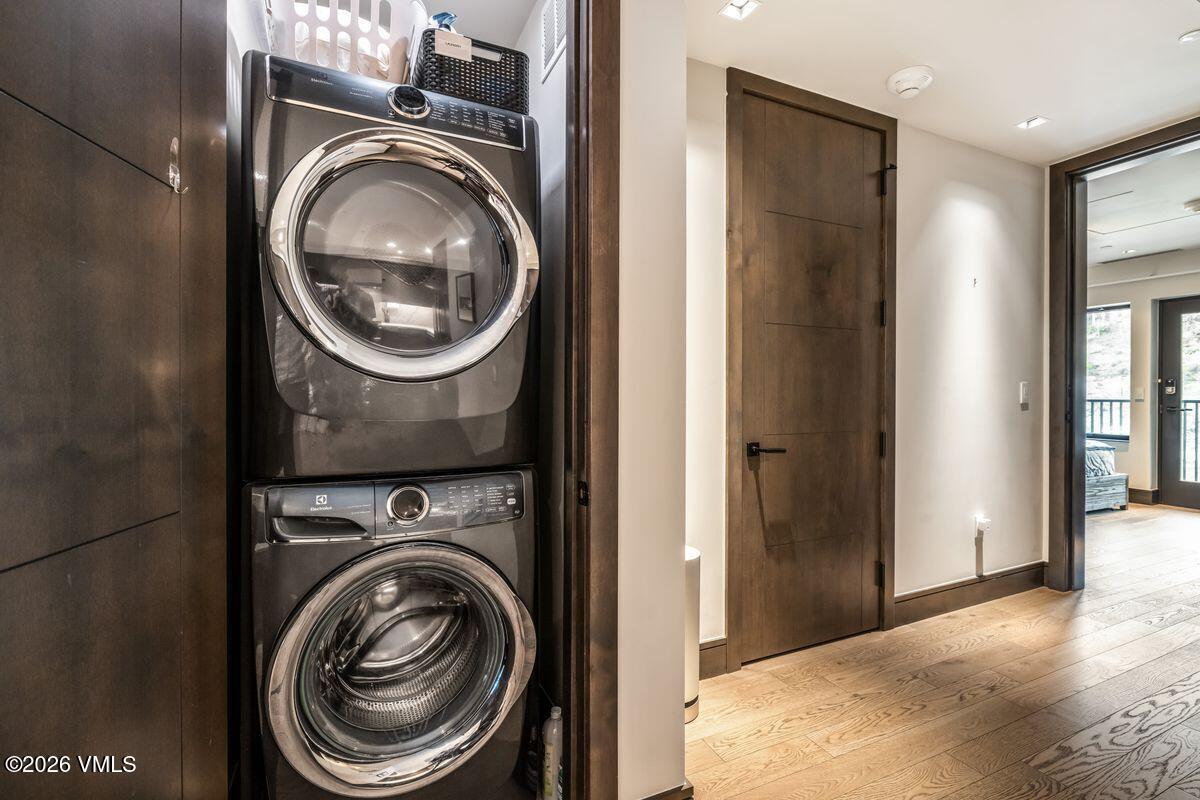 430 South Frontage Road East, Unit RU303 Vail, CO 81657 - Photo 17 of 39 a view of a hallway with washer and dryer