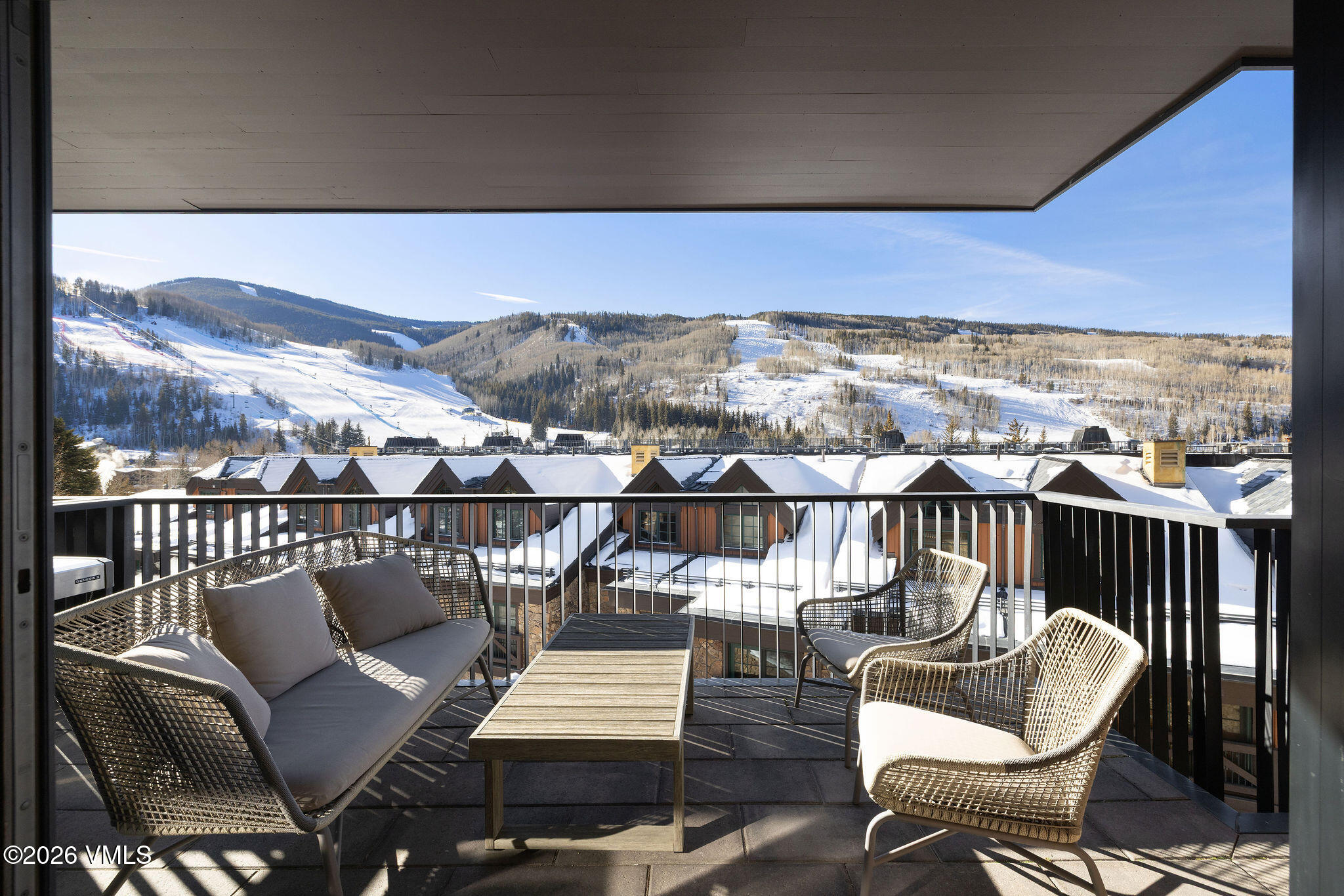 430 South Frontage Road East, Unit RU303 Vail, CO 81657 - Photo 19 of 39 a view of a chairs and table on the terrace