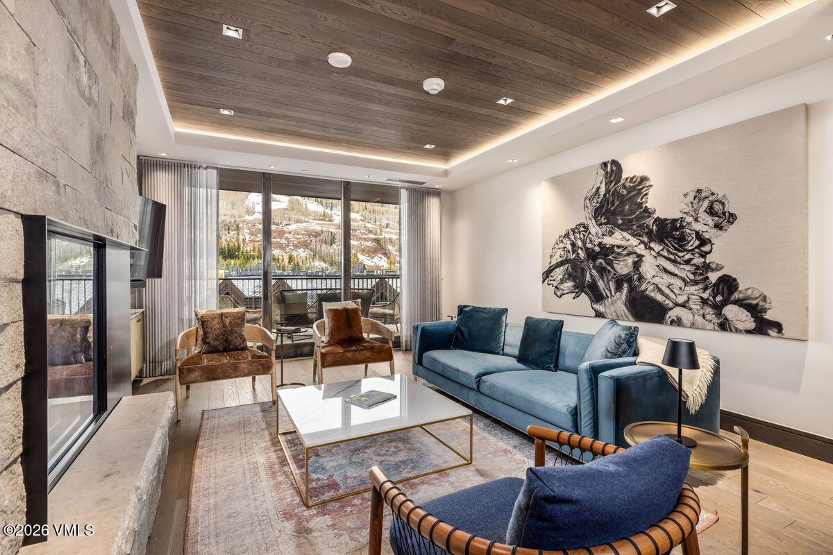 430 South Frontage Road East, Unit RU303 Vail, CO 81657 - Photo 2 of 39 a living room with furniture and a large window