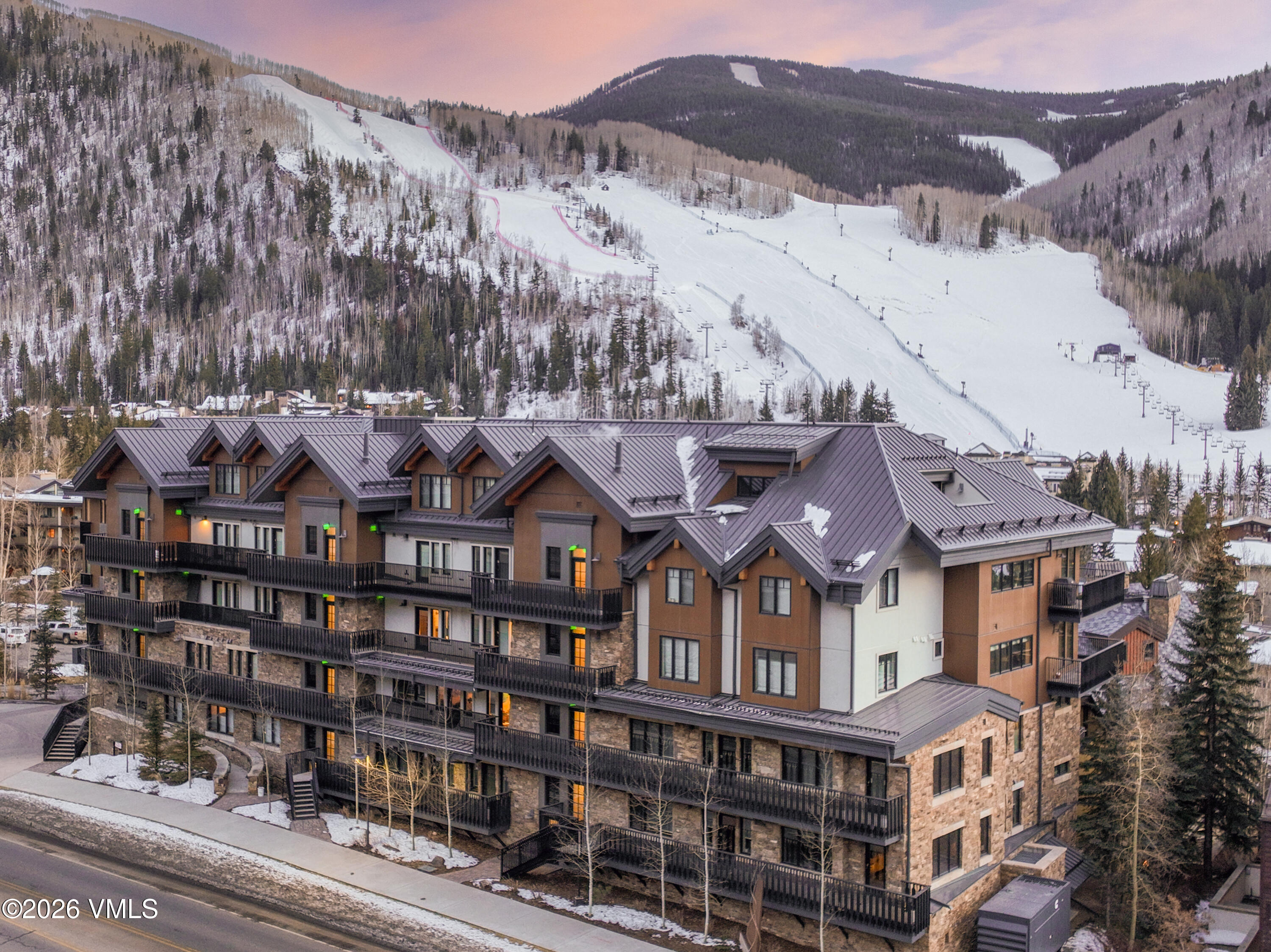 430 South Frontage Road East, Unit RU303 Vail, CO 81657 - Photo 24 of 39 a view of a large building with a mountain in the background