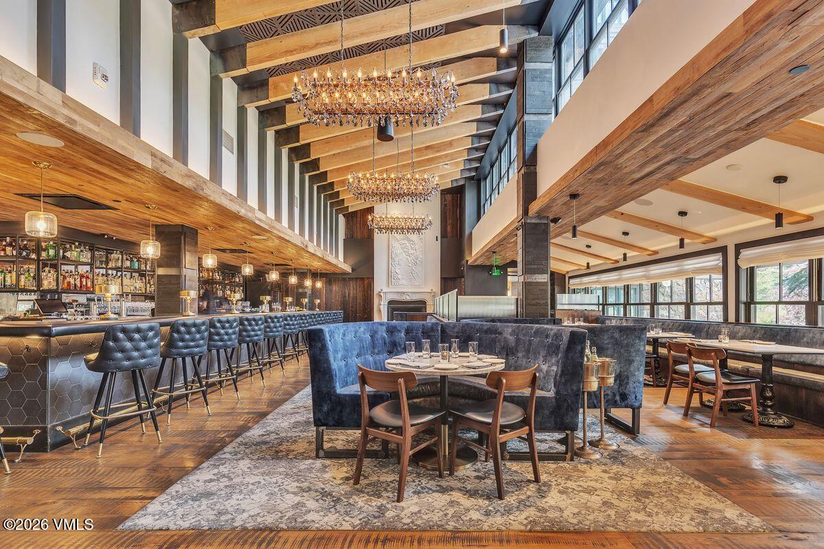 430 South Frontage Road East, Unit RU303 Vail, CO 81657 - Photo 35 of 39 a view of a big building with a table and chairs