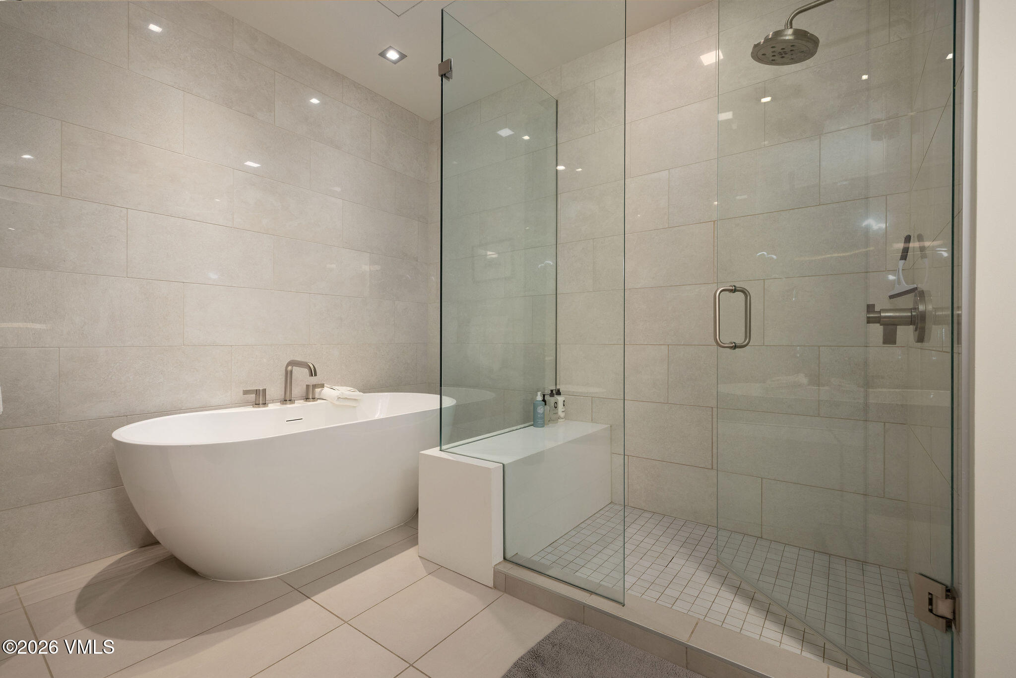 430 South Frontage Road East, Unit RU303 Vail, CO 81657 - Photo 10 of 39 a bathroom with a bathtub and shower