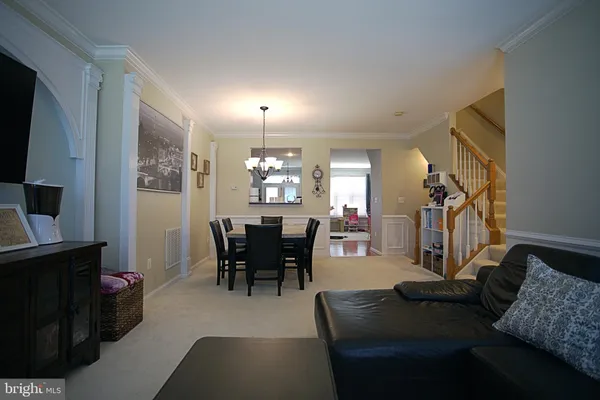 a view of a livingroom with furniture and a mirror