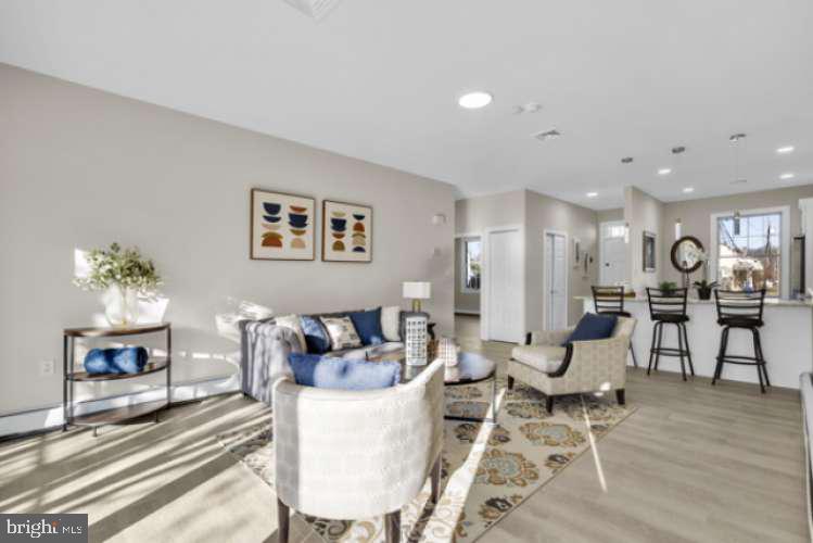 44 Buttonwood Street Mount Holly, NJ 08060 - Photo 17 of 31 a living room with furniture and wooden floor