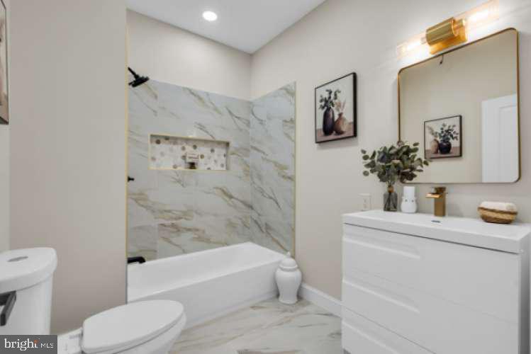 44 Buttonwood Street Mount Holly, NJ 08060 - Photo 20 of 31 a bathroom with a sink toilet and shower