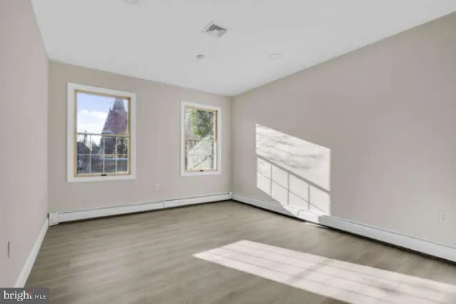 an empty room with windows