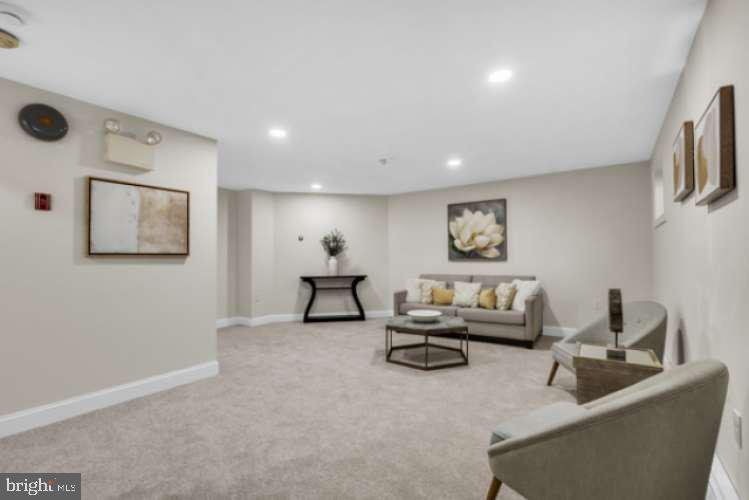 44 Buttonwood Street Mount Holly, NJ 08060 - Photo 23 of 31 a living room with furniture and a flat screen tv
