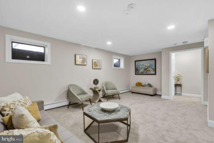 44 Buttonwood Street Mount Holly, NJ 08060 - Photo 25 of 31 a living room with furniture and a wooden floor
