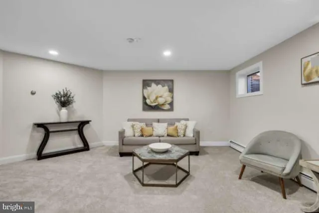 a living room with furniture and a chair