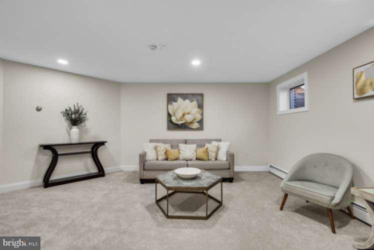 44 Buttonwood Street Mount Holly, NJ 08060 - Photo 27 of 31 a living room with furniture and a chair
