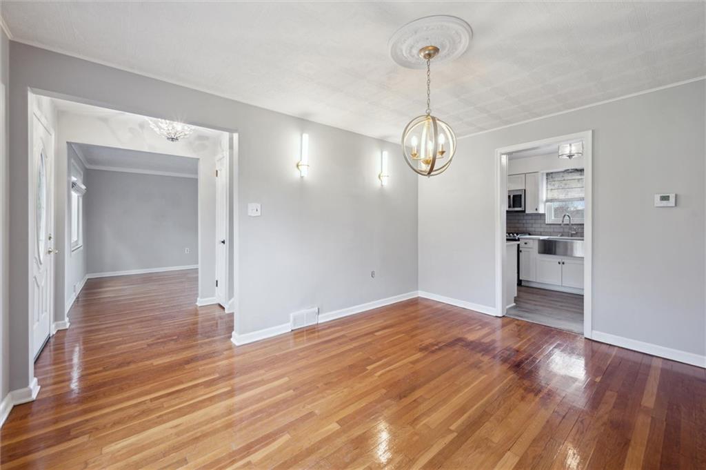 2936 Brodhead Road Aliquippa, PA 15001 - Photo 11 of 47 a view of a room with wooden floor and kitchen view