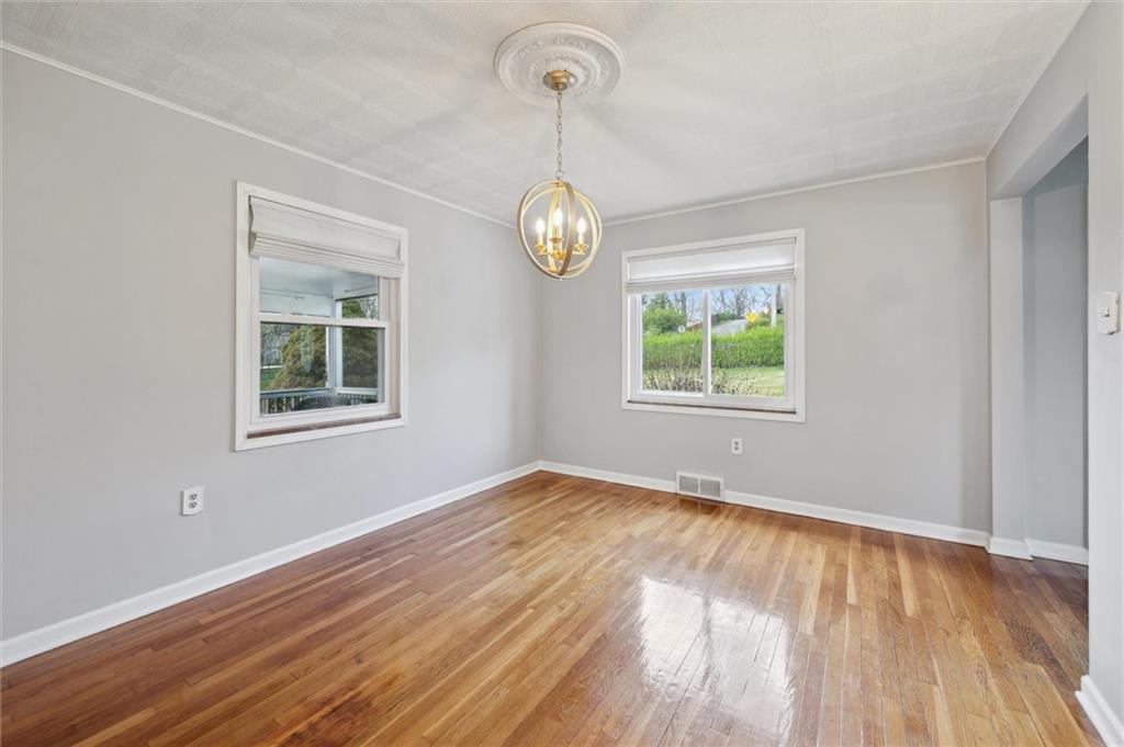 2936 Brodhead Road Aliquippa, PA 15001 - Photo 13 of 47 a view of empty room with window and wooden floor